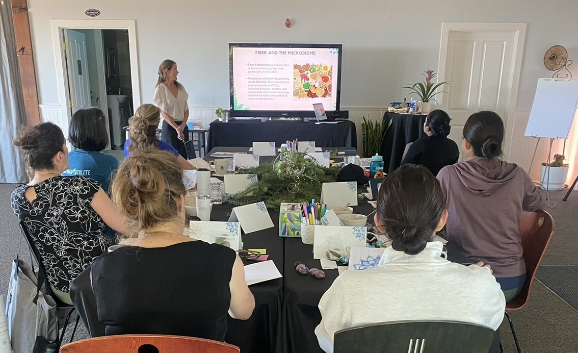 Patty presenting to a team at Living Well USA