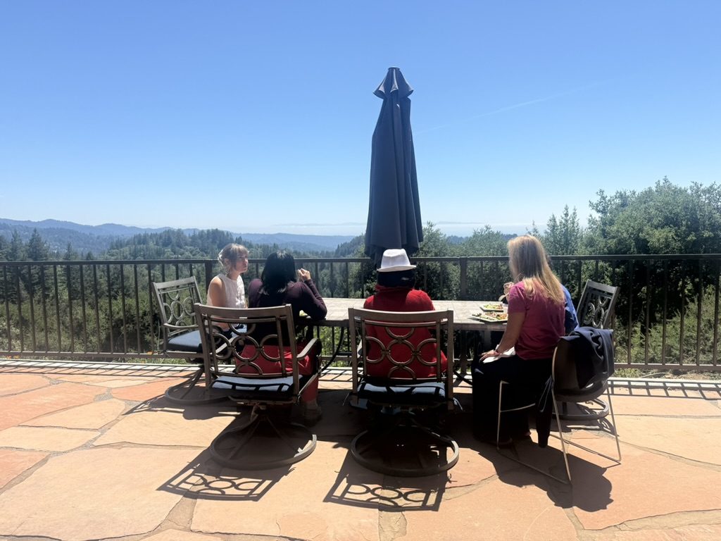An outdoor team meeting at Living Well USA